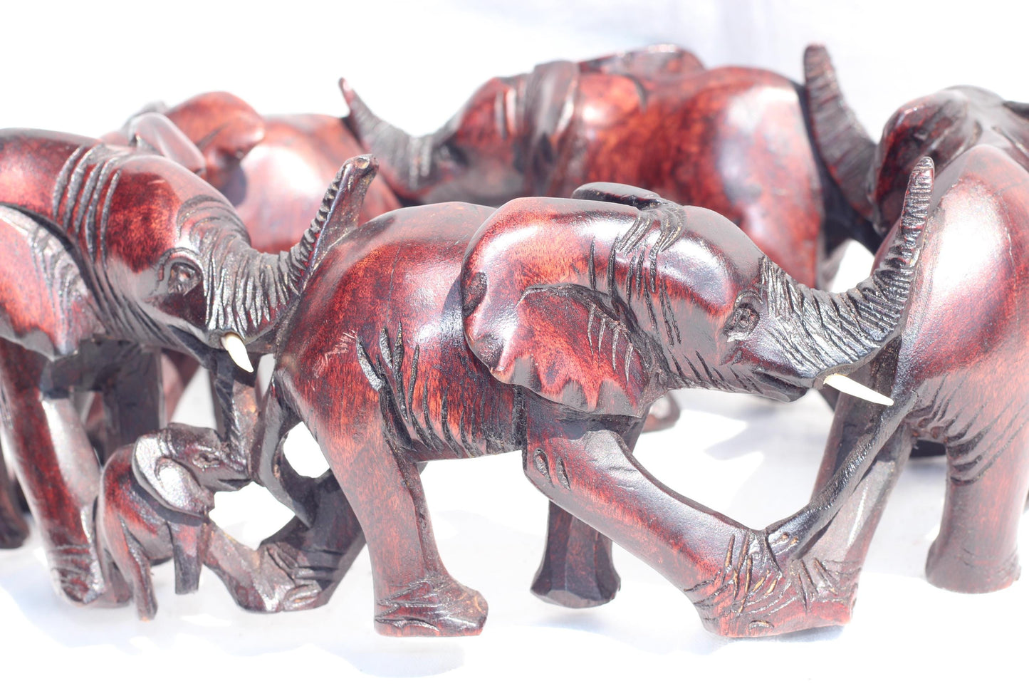 6 Adults, 3 Calfs Olive Wood Carved Continueous Circle Elephant Herd Decor ornaments. Dark brown handcarved African Art decor. Safari Gifts