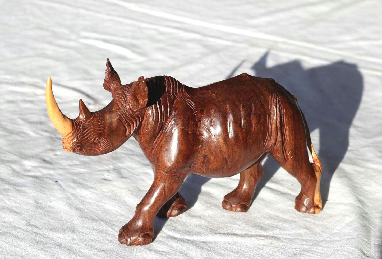 Smooth handcarved multi coloured Ironwood Rhino Sculpture. Zimbabwean lifelike Safari Animals Decor figurine. Unique African Art gift.