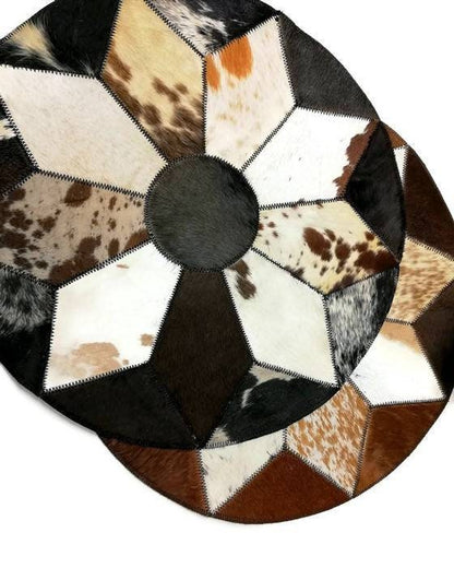 19 inch Nguni Cow Hide Patchwork Rugs. Authentic mixed leather patches, Star pattern on circle design with over lock joining. African Decor