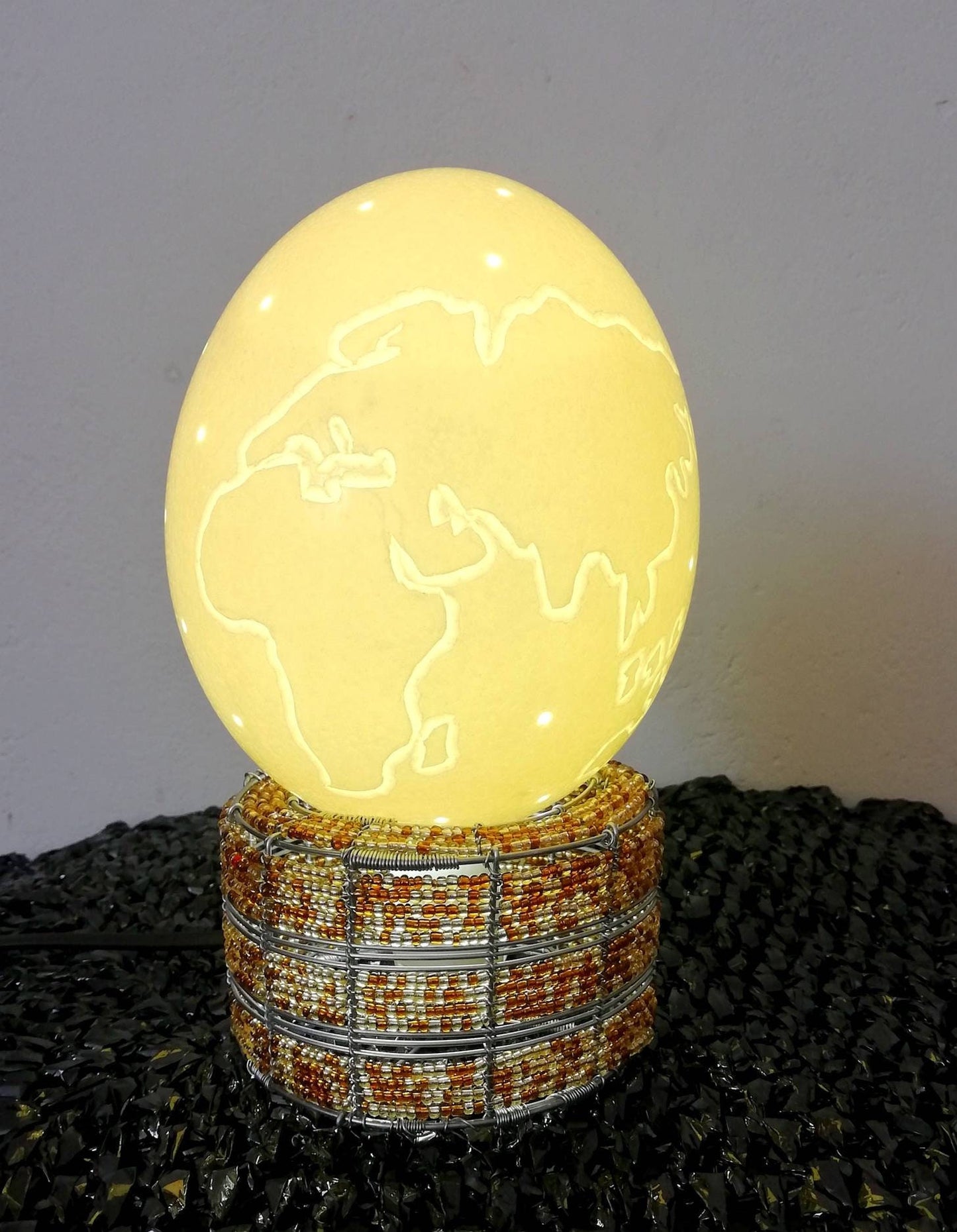 World Map Globe carved on Authentic Ostrich Egg Shell and a beaded brown lamp. Shipping Worldwide from Cape Town South Africa. Home Lighting