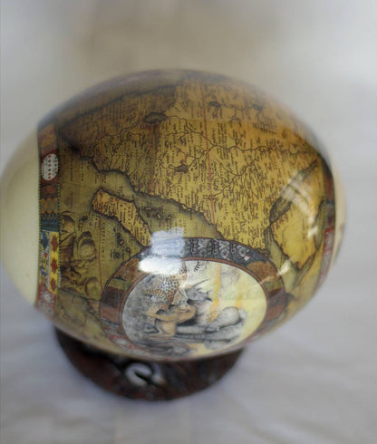 Brown Ostrich Egg Decoupage Art for home and office decoration gifts. Has African Map and big 5 Animals. Comes with a Carved Wood Ring stand