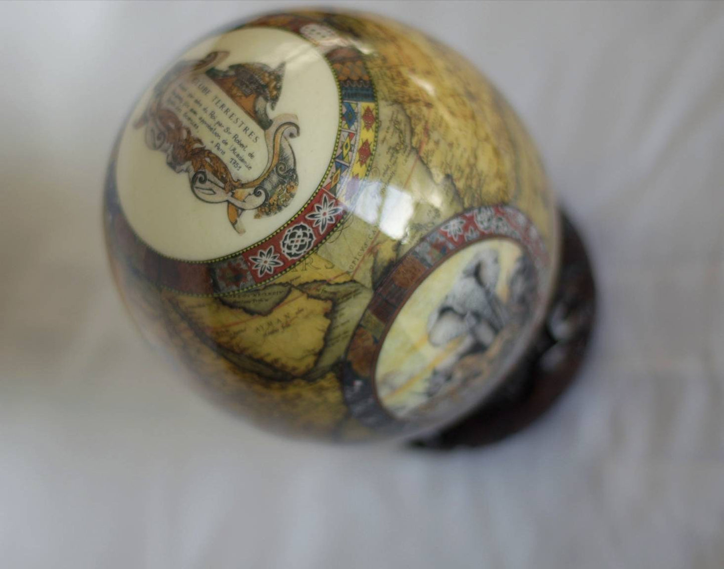 Brown Ostrich Egg Decoupage Art for home and office decoration gifts. Has African Map and big 5 Animals. Comes with a Carved Wood Ring stand