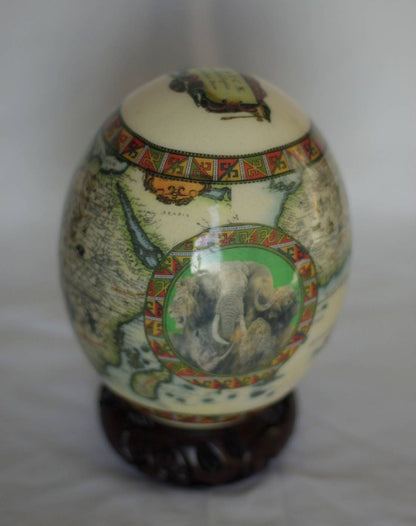 Green African Map Decoupage Ostrich Egg Shell with Big Five Animals on a green background circle. Express Shipping Worldwide. Art gifts