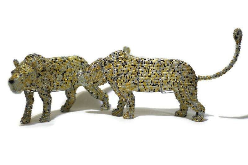 Light brown, clear and black beaded Leopard figurines by Job Guwhe. Express Shipping Worldwide, custom Orders Welcome. Walking big cat art