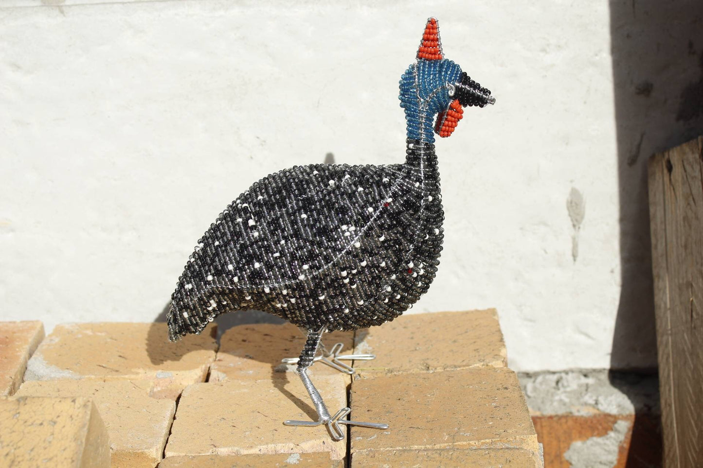 20cm Tall beaded Guinea Fowl Sculpture. Black, white, grey beads and wire handmade by Job Guwhe. African Art gifts/Souvenirs. Ships Express