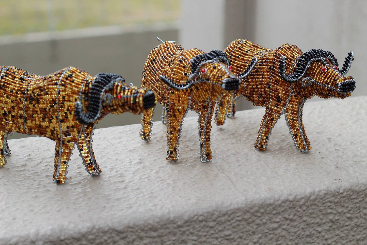 Beaded Water Buffalo figurines by Job Guwhe. Handmade Gold, brown, black beads and wire animals. Home / Office Decor Ready to Ship Express