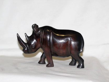 Smooth Zambian Ebony wood handcarved Rhino. Unique African Art Gifts, for home and office decor. Walking Long Horn Rhinoceros figurines.