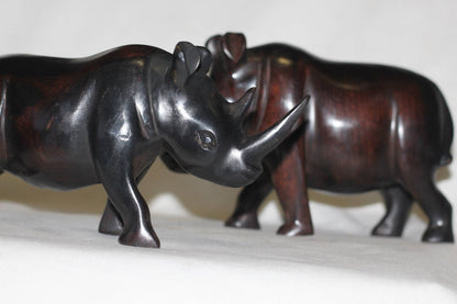 Smooth Zambian Ebony wood handcarved Rhino. Unique African Art Gifts, for home and office decor. Walking Long Horn Rhinoceros figurines.