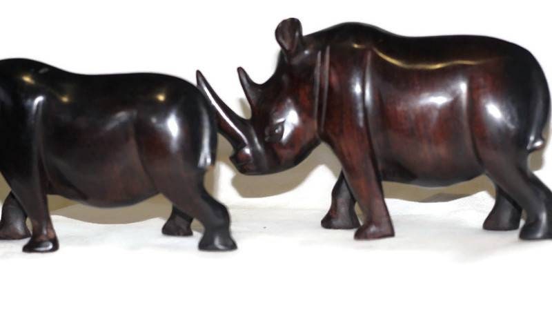 Smooth Zambian Ebony wood handcarved Rhino. Unique African Art Gifts, for home and office decor. Walking Long Horn Rhinoceros figurines.