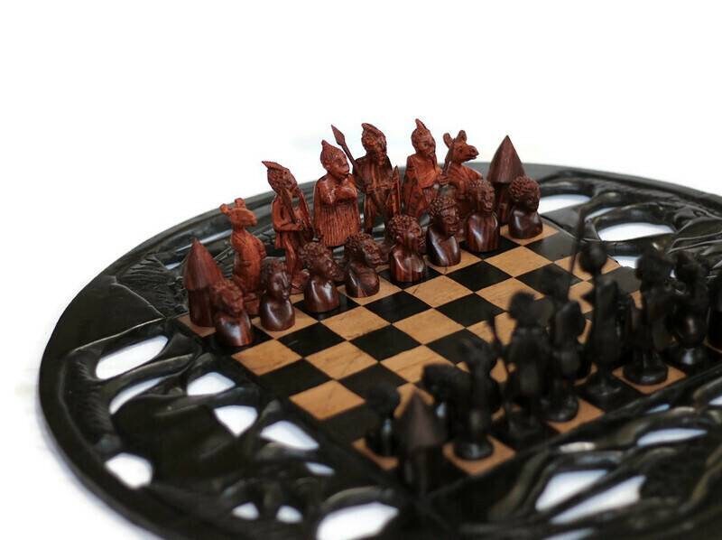 20inch Ebony and Olive Wood Carved Chess set. Giraffes, Rhino,  Elephant cuttings on the board. Ebony and Zebra Wood Zulu Warriors Pieces.