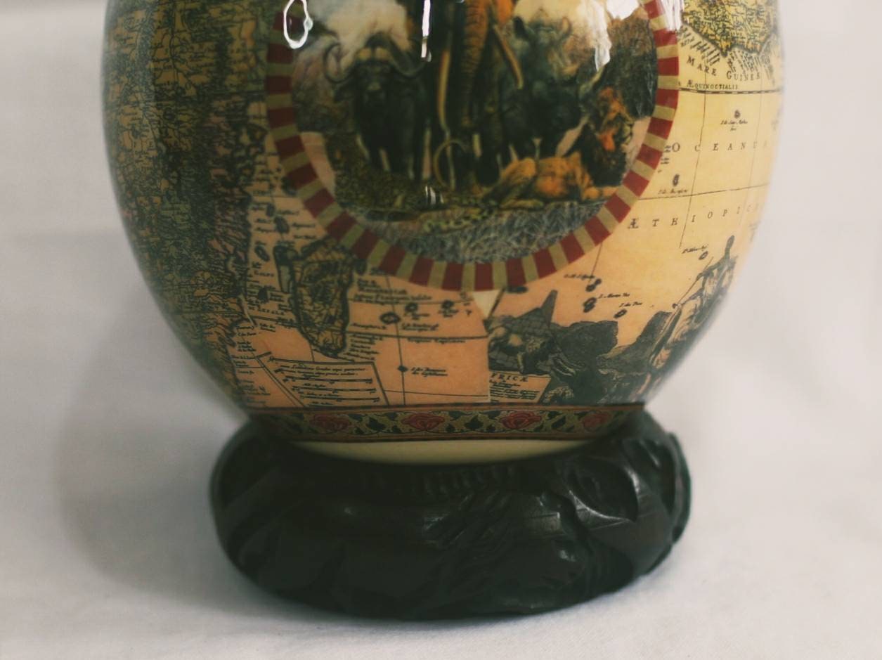 Ostrich Egg Decoupage art with African Map and Big Five Animals on a dashed maroon Circle. Brown Unique gifts Decor, with carved wood stand