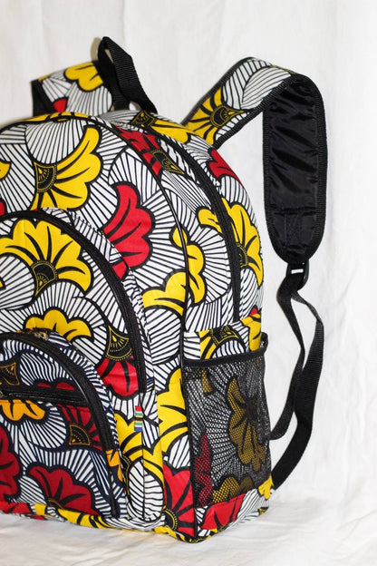 Large African Print Travel Backpack. Yellow, Red, black and white Ankara bag with multiple pockets and adjustable straps. Ships Express