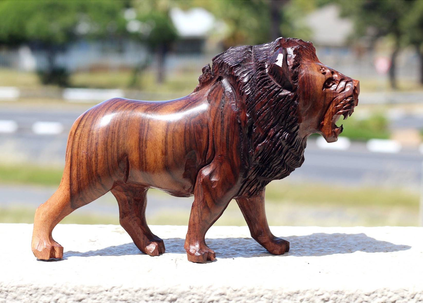 Fine Art Lion King Handcarved Ironwood Masterpiece. Walking Lifelike figurine. Smooth carving visible grain Zimbabwean made. Christmas gifts