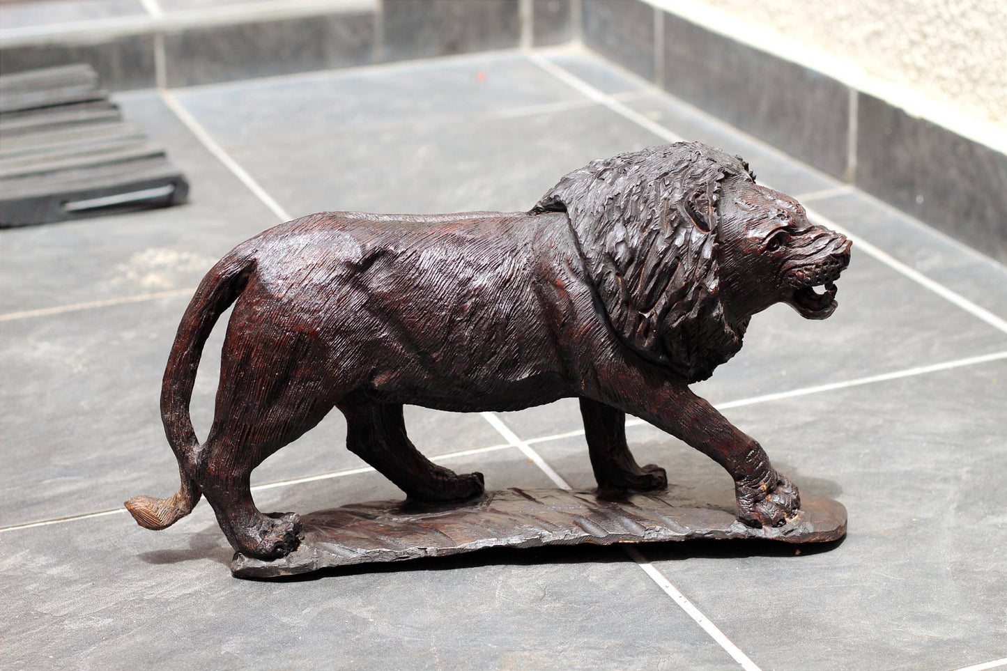 Large Handcarved lion Iron wood figurine. Dark Brown African hardwood walking animal Sculpture with base. Unique handmade Gift from Zimbabwe