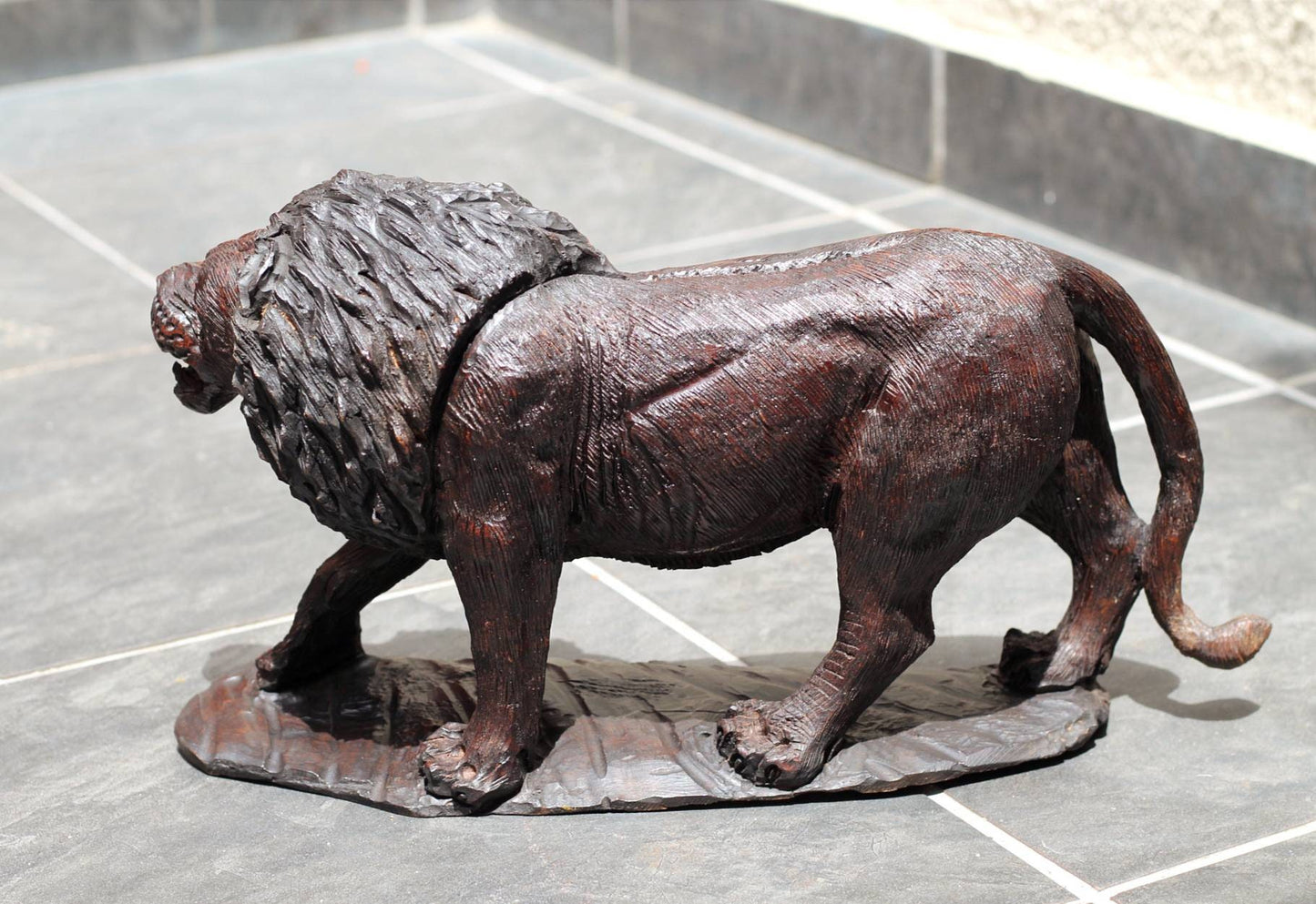 Large Handcarved lion Iron wood figurine. Dark Brown African hardwood walking animal Sculpture with base. Unique handmade Gift from Zimbabwe