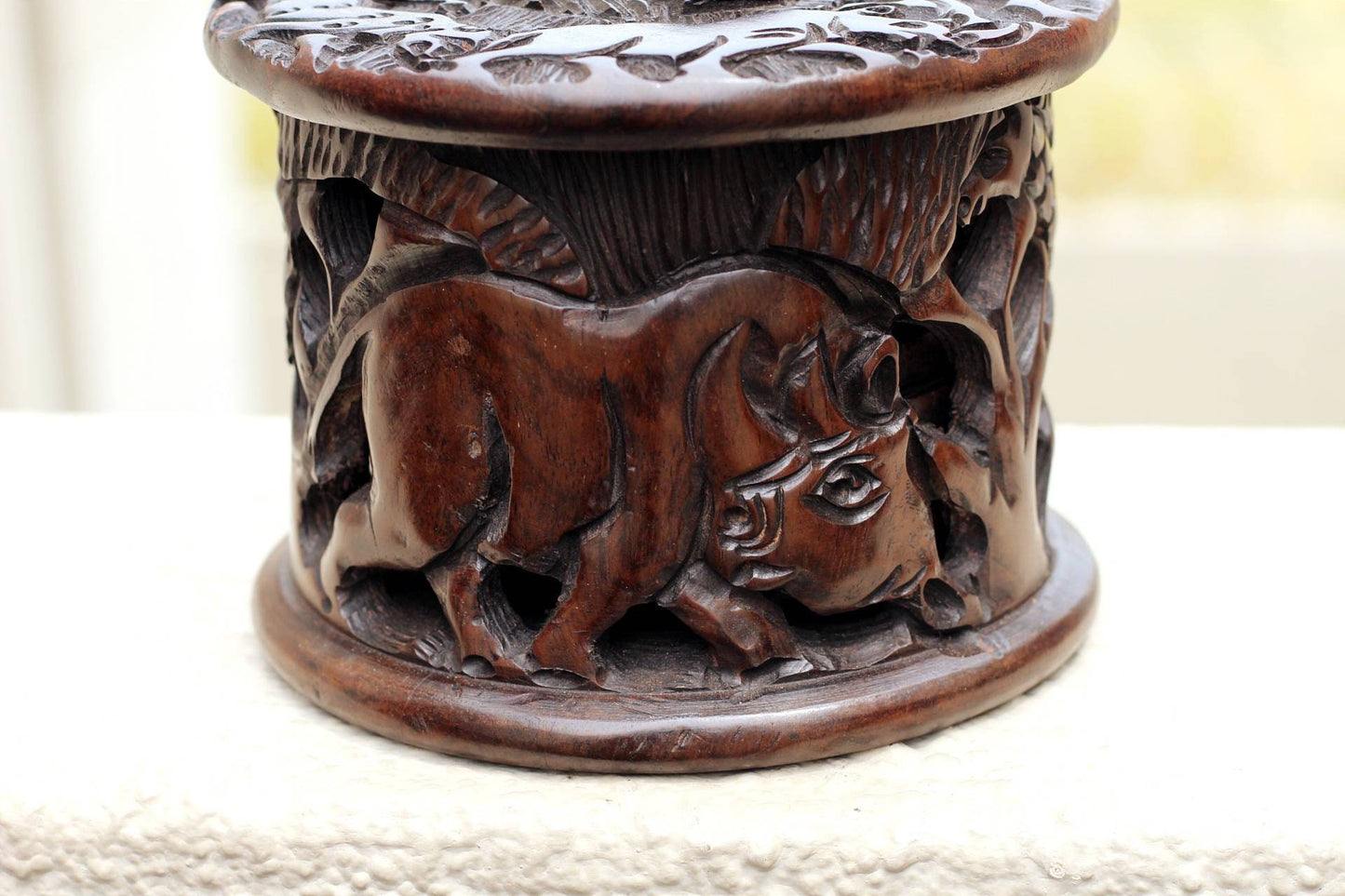 Ebony wood Carved Coasters Set in a case. Big Five Animals on the lid and Coasters with Rhino, Elephant and Zebra Carved on the container.