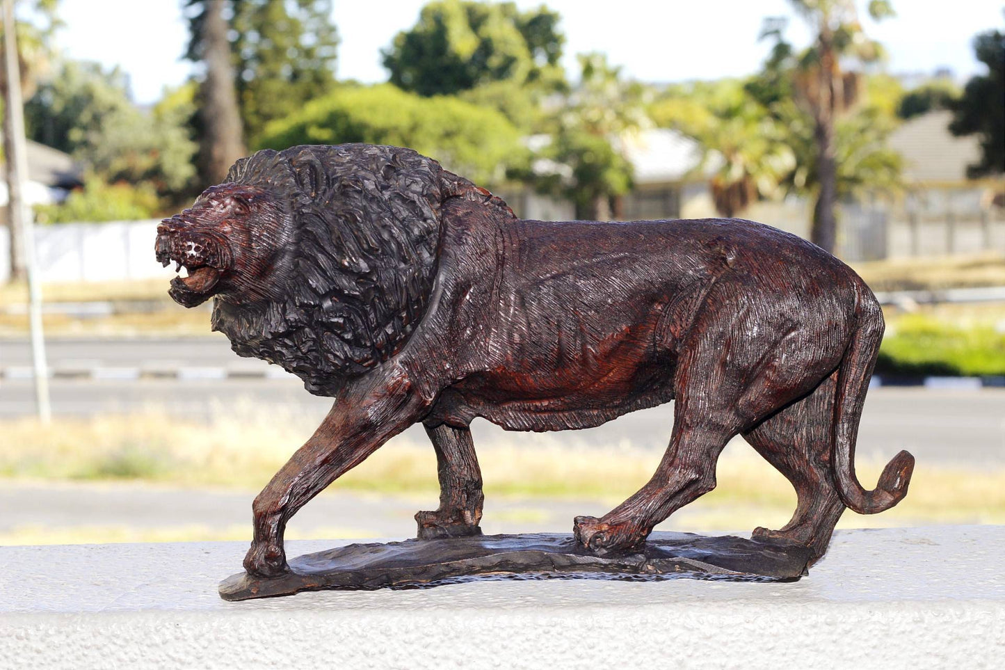 Large Handcarved lion Iron wood figurine. Dark Brown African hardwood walking animal Sculpture with base. Unique handmade Gift from Zimbabwe