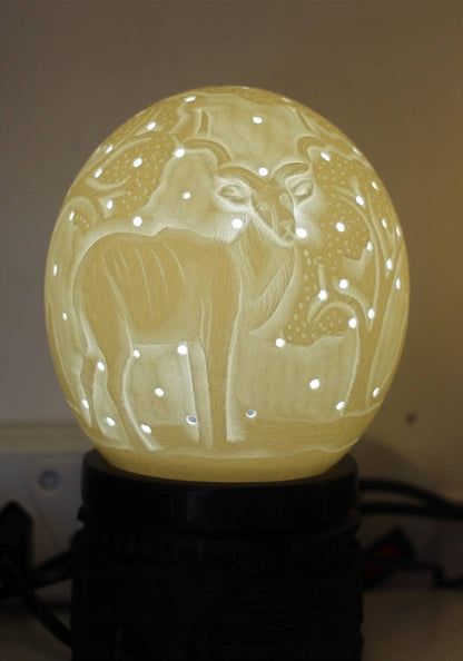 Ostrich Egg Fine Art carved Kudu Antelope Lampshade. Authentic shell with and tree carvings and Holes. House warming/ office lighting gifts