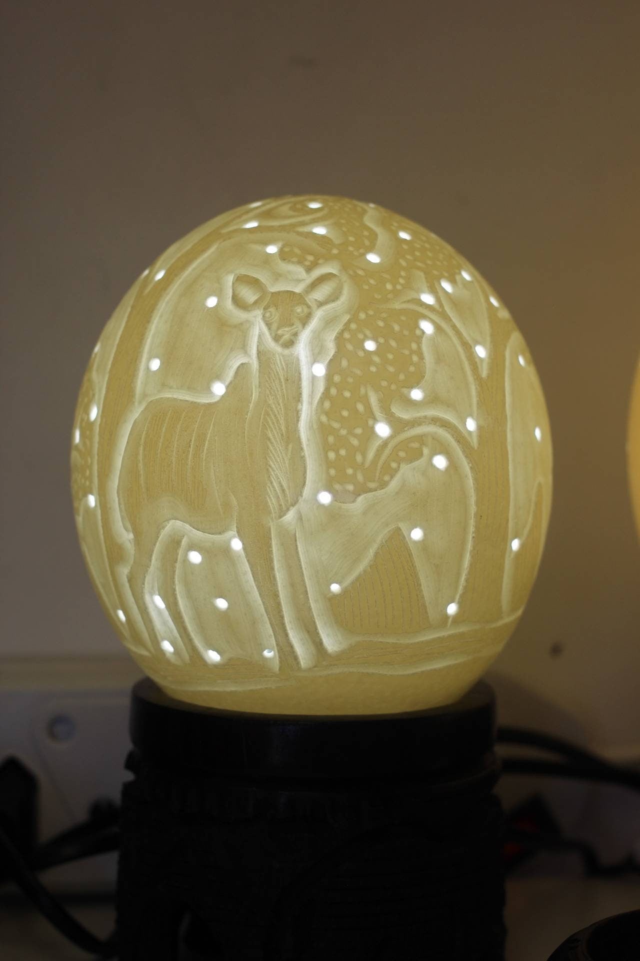 Ostrich Egg Fine Art carved Kudu Antelope Lampshade. Authentic shell with and tree carvings and Holes. House warming/ office lighting gifts