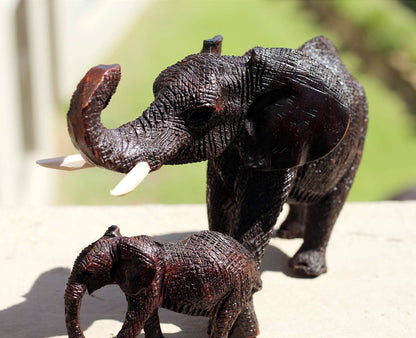 Charging Mother Elephant and Calf Ironwood Sculpture. Zimbabwean hand carved fully detailed lifelike figurines. African Big 5 Fine Art Gifts