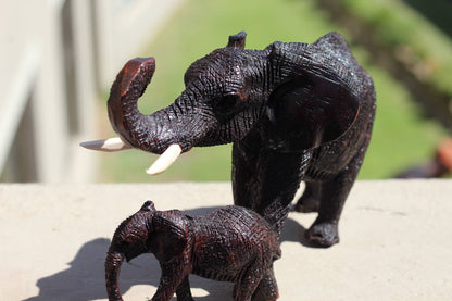 Charging Mother Elephant and Calf Ironwood Sculpture. Zimbabwean hand carved fully detailed lifelike figurines. African Big 5 Fine Art Gifts