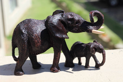 Charging Mother Elephant and Calf Ironwood Sculpture. Zimbabwean hand carved fully detailed lifelike figurines. African Big 5 Fine Art Gifts