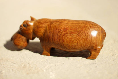 Mubanga Wood Handcarved Hippo figurine. Zambian Kiaat Smooth wooden Safari sculptures. Unique wood grain on a light brown hardwood piece.