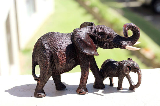 Charging Mother Elephant and Calf Ironwood Sculpture. Zimbabwean hand carved fully detailed lifelike figurines. African Big 5 Fine Art Gifts