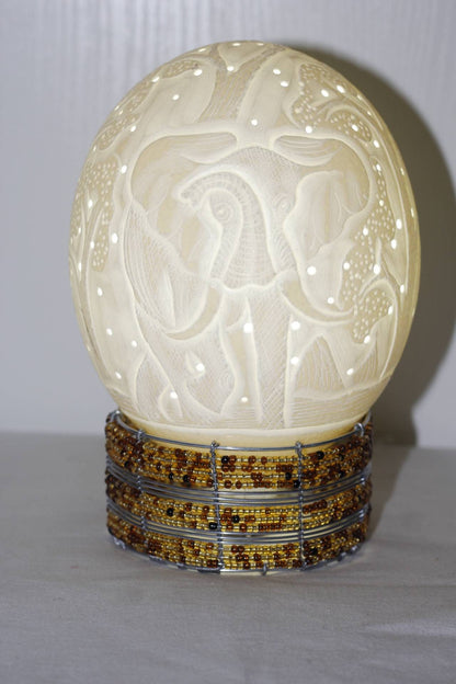 Ostrich Egg Fine Art carved Charging Elephant Lampshade. Authentic shell with tree carvings and Holes. Housewarming/office lighting gifts