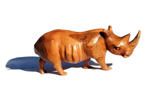 Nashorn-Skulptur aus handgeschnitztem, glattem Mukwa-Holz. Nashornfiguren im simbabwischen Stil. Einzigartige Geschenke für afrikanische Tiere, versandfertig