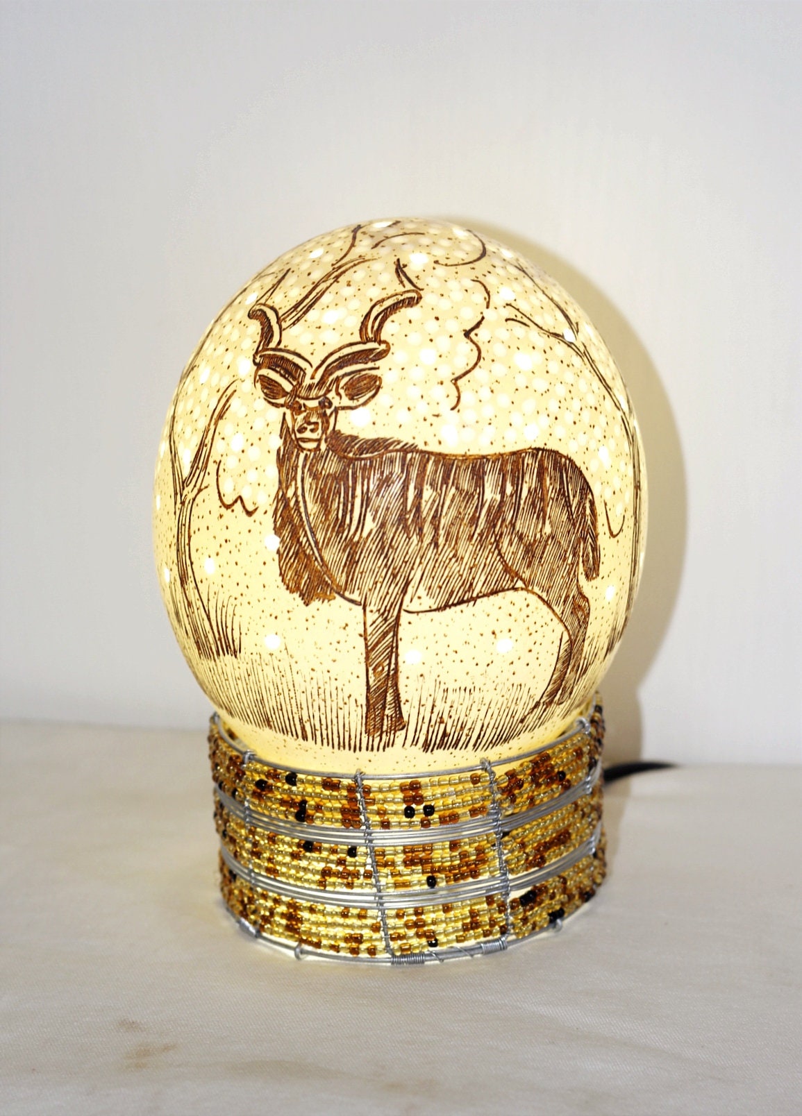 Scrimshaw Carved Kudu Antelope Ostrich Egg lampshade with Holes and tree Carvings. African art Ready to Ship Gift. Beaded lampstand optional