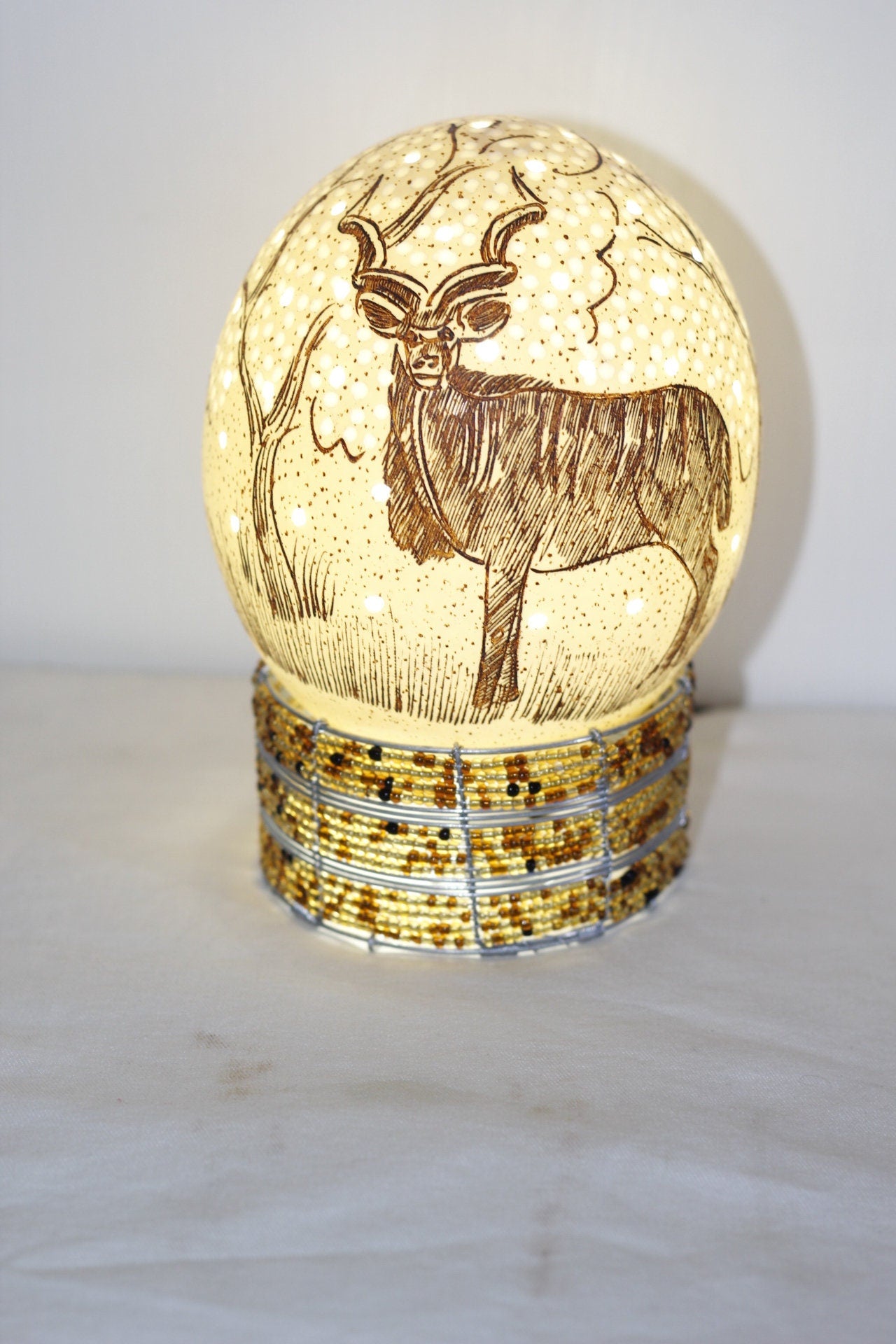 Scrimshaw Carved Kudu Antelope Ostrich Egg lampshade with Holes and tree Carvings. African art Ready to Ship Gift. Beaded lampstand optional