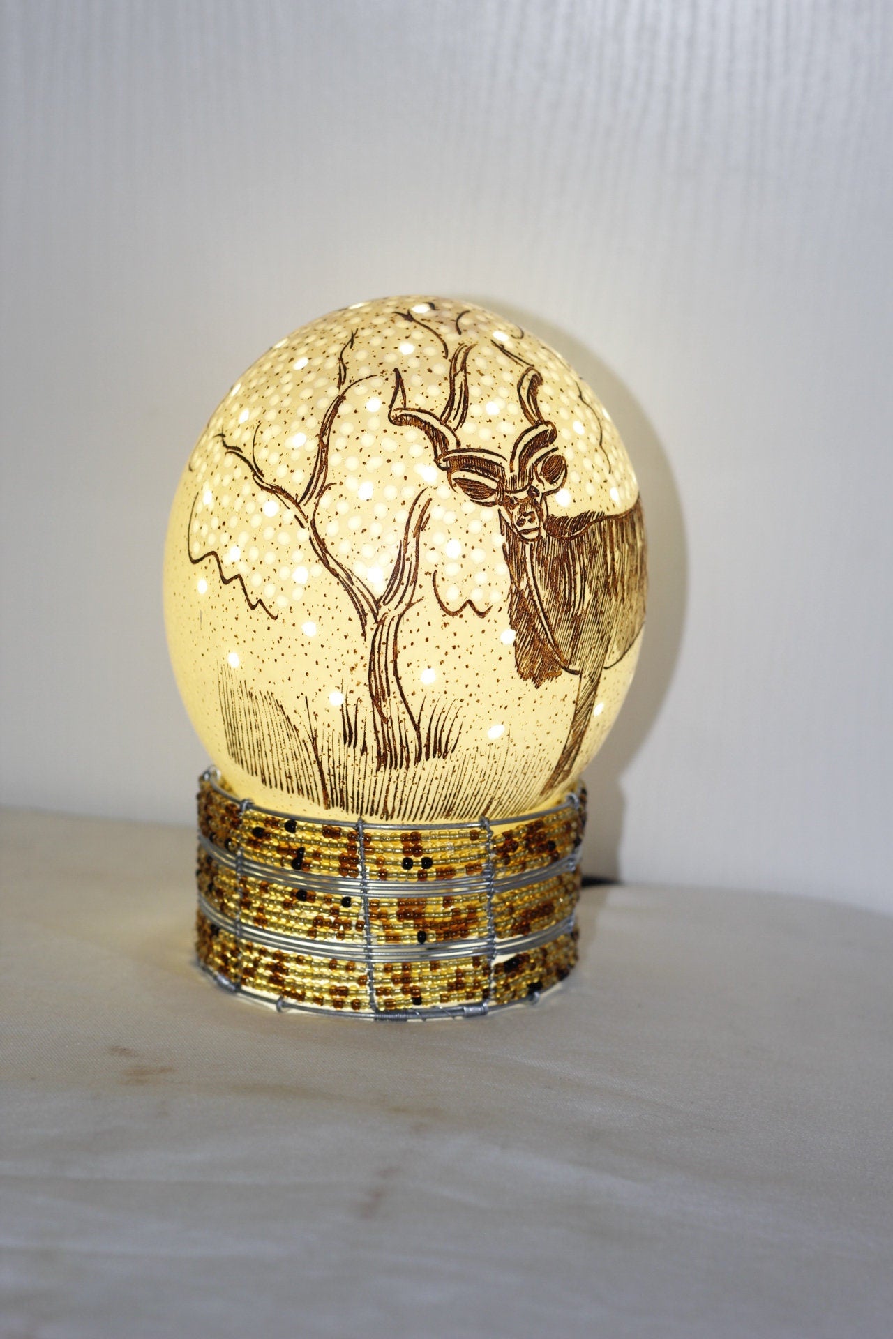 Scrimshaw Carved Kudu Antelope Ostrich Egg lampshade with Holes and tree Carvings. African art Ready to Ship Gift. Beaded lampstand optional