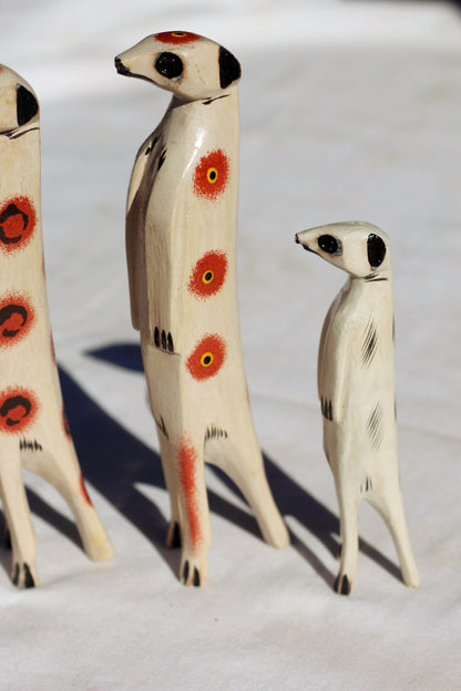 Family of 4 Clear with Orange, Red Painted Meerkat Jacaranda Wood sculptures. Hand Carved figurines. Home/Office interior decor African Art.