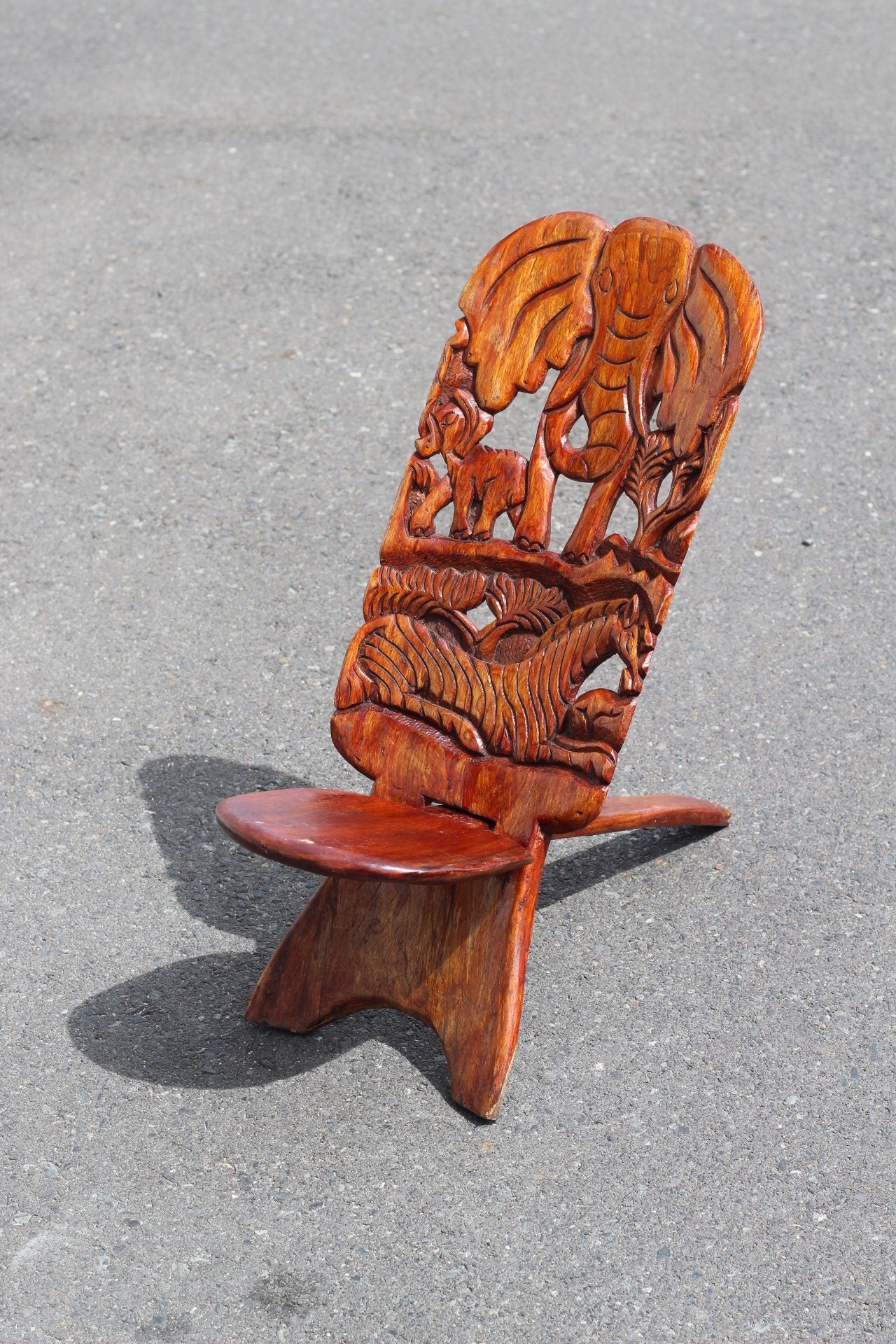 Medium Sized African Vanished Foldable chair. Malawian Mahogany Carved Elephant head and Sleeping Lion theme. Home / Office Art decor gifts