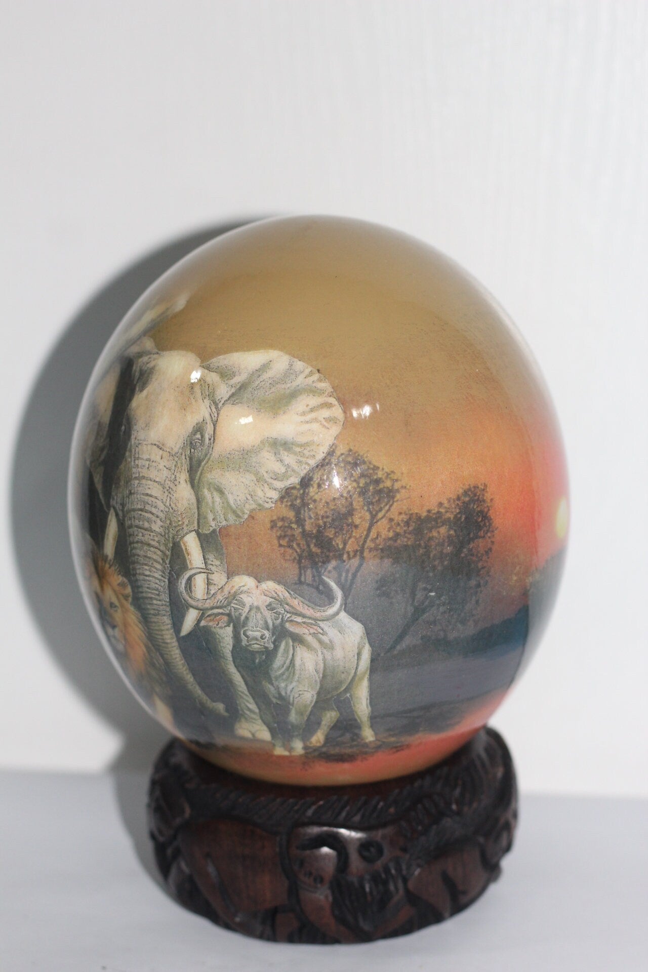 Brown Decoupage African Big Five Animals on Authentic Ostrich Egg Shell. Sunset Art, Comes with a Malawian carved ring stand. Ready to Ship