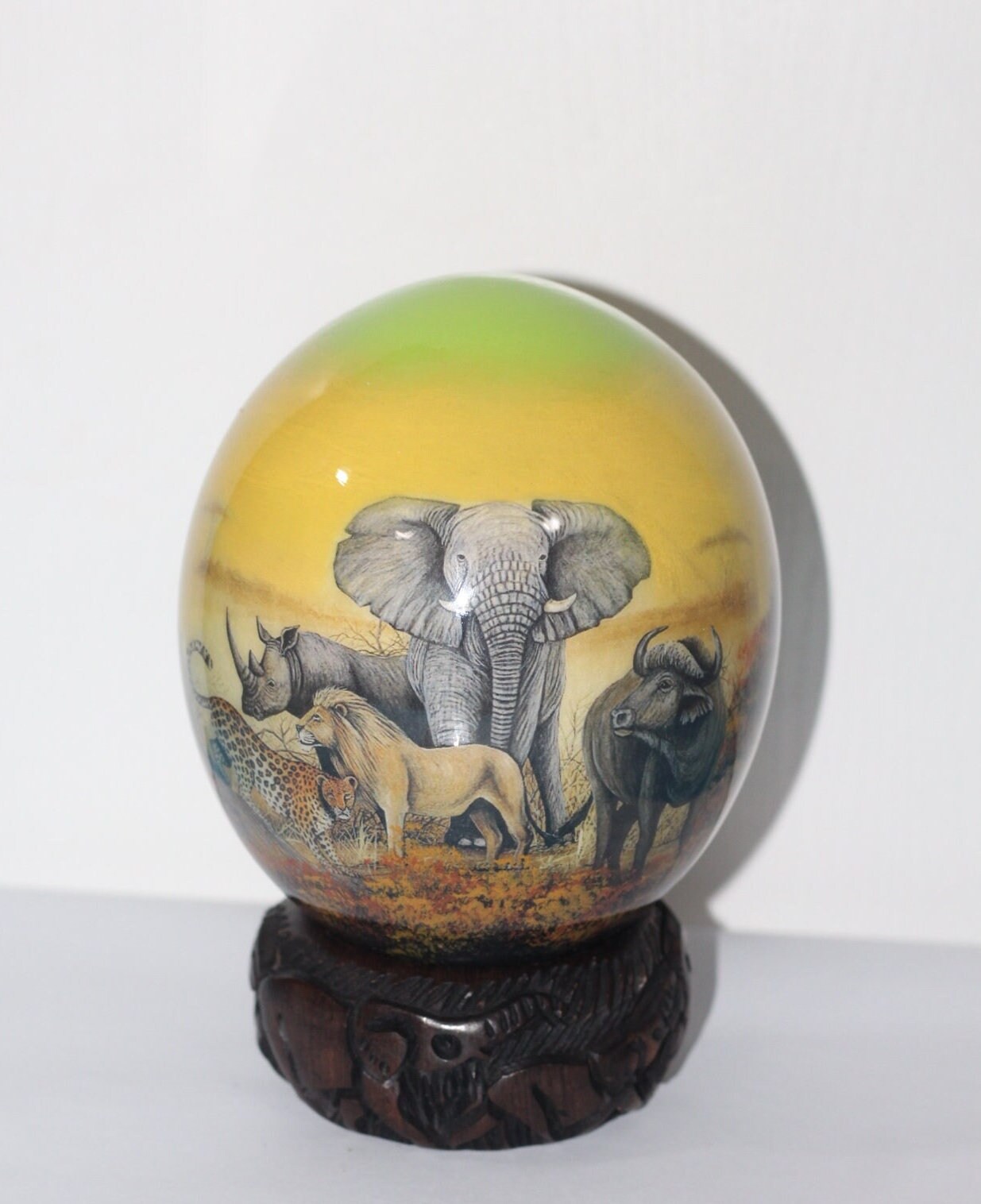 Green and Yellow Decoupage African Big Five Animals on Authentic Ostrich Egg Shell gifts. Comes with a Malawi ring stand, ready to Ship.