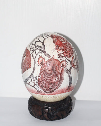 Ostrich Egg Fine Art Scrimshaw featuring the African Big 5 Heads. Burnt Amber and Toney Red Authentic Ostrich Egg Painted Safari Carving.