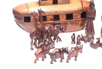 Noah's Ark Iron Wood Malawian handcarved masterpiece. 21 pieces animals pairs figurines including Noah and a dove landing on top of the Ark.