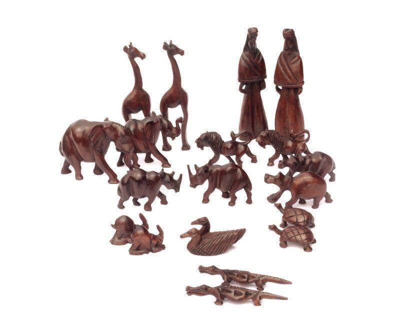 Noah's Ark Iron Wood Malawian handcarved masterpiece. 21 pieces animals pairs figurines including Noah and a dove landing on top of the Ark.