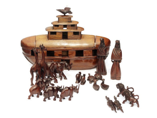 Noah's Ark Iron Wood Malawian handcarved masterpiece. 21 pieces animals pairs figurines including Noah and a dove landing on top of the Ark.