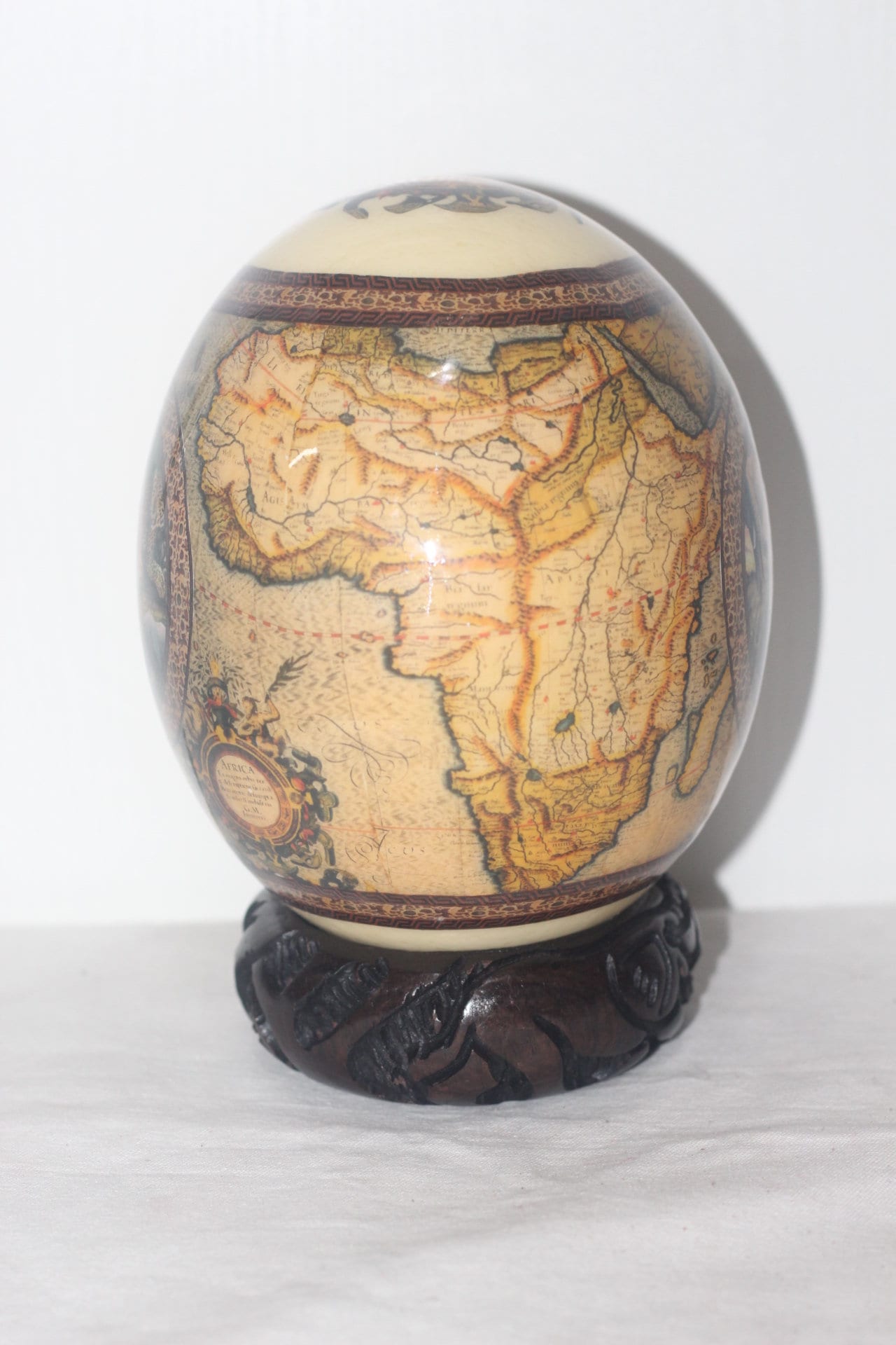 Brown or Green African Map Ostrich Egg Decoupage Art with big 5 Animals on a circle. Comes with a Carved Wood Ring stand. Home/Office Decor