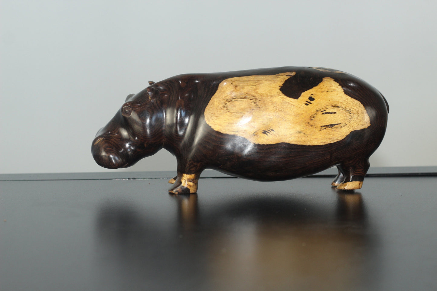 Lifelike Multi Coloured Ebony Wood Carved Hippo Sculpture. Has visible wood grains in the dark rich wood. Unique African gifts ready to Ship