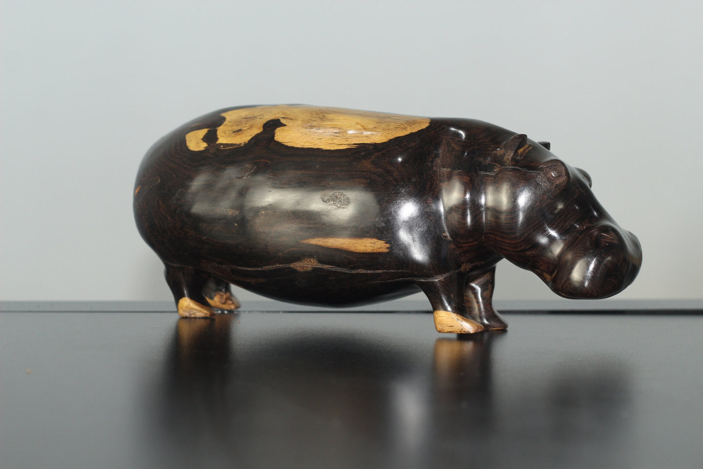 Lifelike Multi Coloured Ebony Wood Carved Hippo Sculpture. Has visible wood grains in the dark rich wood. Unique African gifts ready to Ship