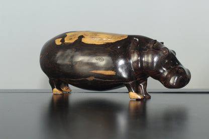 Lifelike Multi Coloured Ebony Wood Carved Hippo Sculpture. Has visible wood grains in the dark rich wood. Unique African gifts ready to Ship