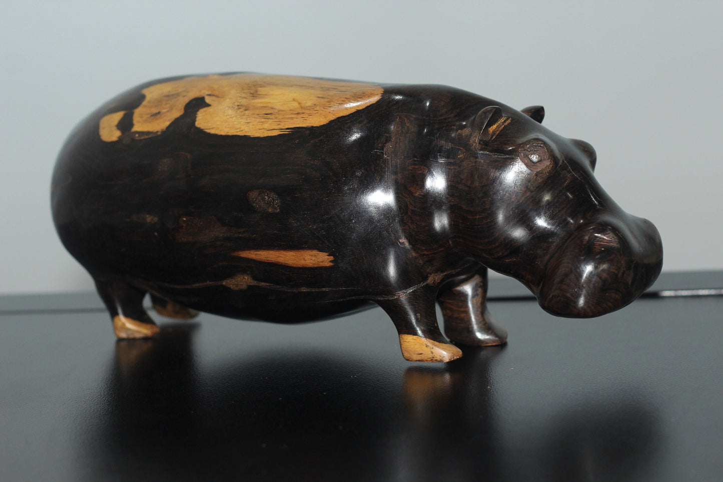 Lifelike Multi Coloured Ebony Wood Carved Hippo Sculpture. Has visible wood grains in the dark rich wood. Unique African gifts ready to Ship