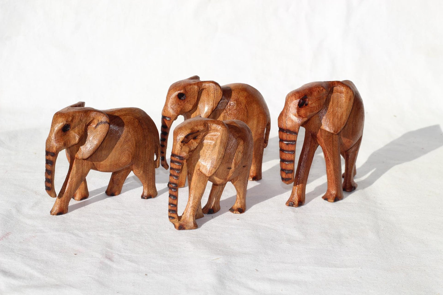Set of 4 Hand Carved Elephant Herd Olive wood. Light brown polished African art Souvenirs, unique housewarming gift. Ready to Ship Worldwide
