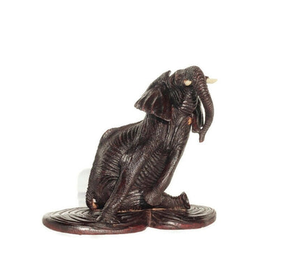 Ironwood lifelike Seating Looking Up Elephant fully detailed Masterpiece on a Wooden base. Zimbabwean Handcarved Dark brown Office/Home Deco