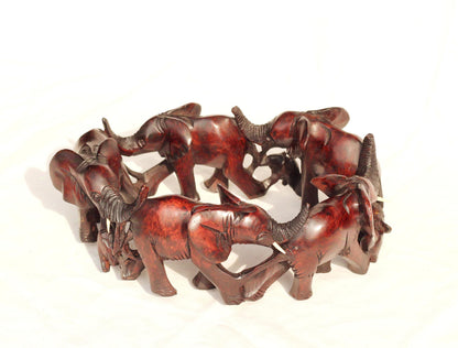 6 Adults, 3 Calfs Olive Wood Carved Continueous Circle Elephant Herd Decor ornaments. Dark brown handcarved African Art decor. Safari Gifts
