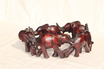 6 Adults, 3 Calfs Olive Wood Carved Continueous Circle Elephant Herd Decor ornaments. Dark brown handcarved African Art decor. Safari Gifts
